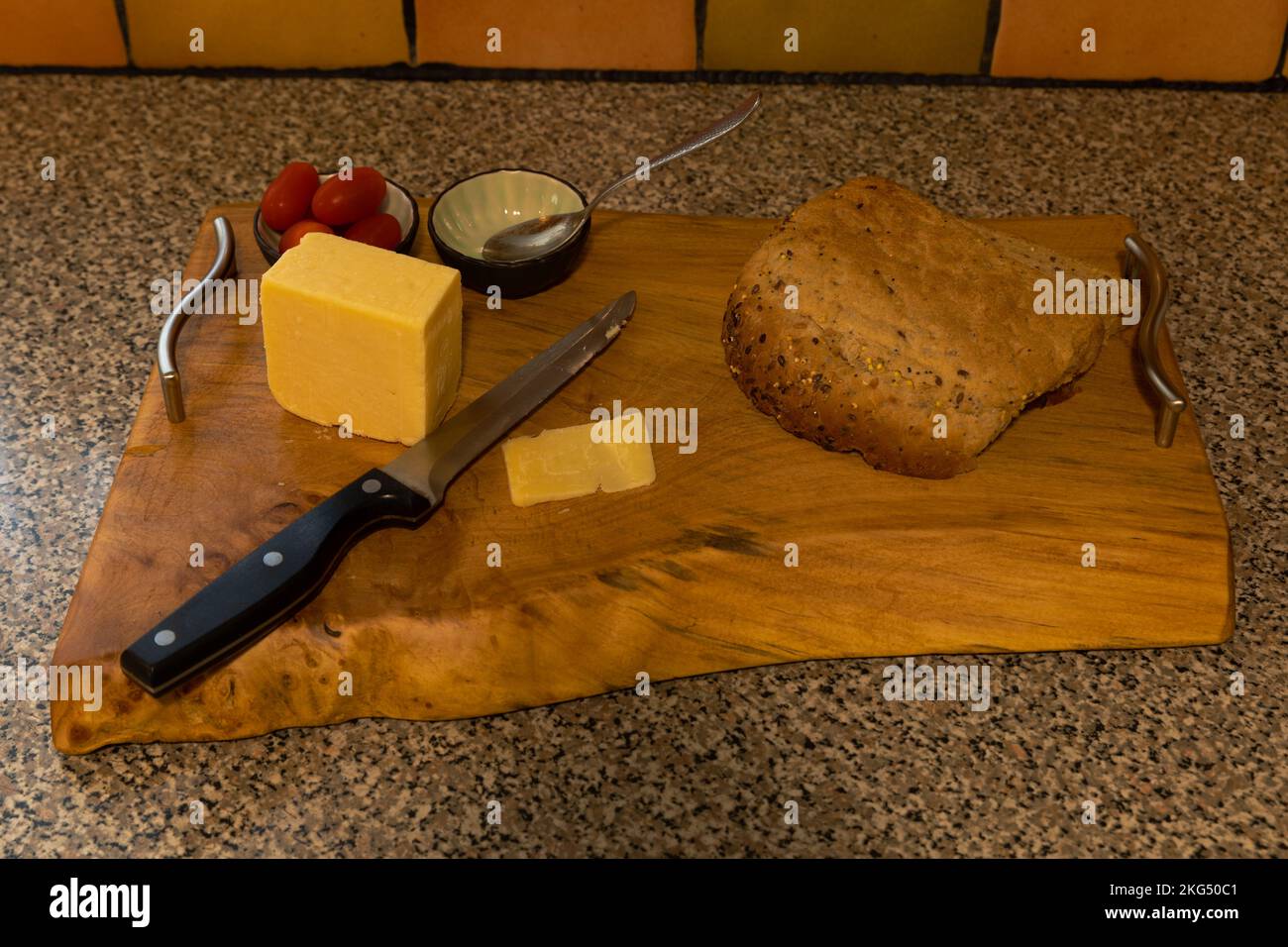Hardwood charcuterie serving platter with food produce ready to serve