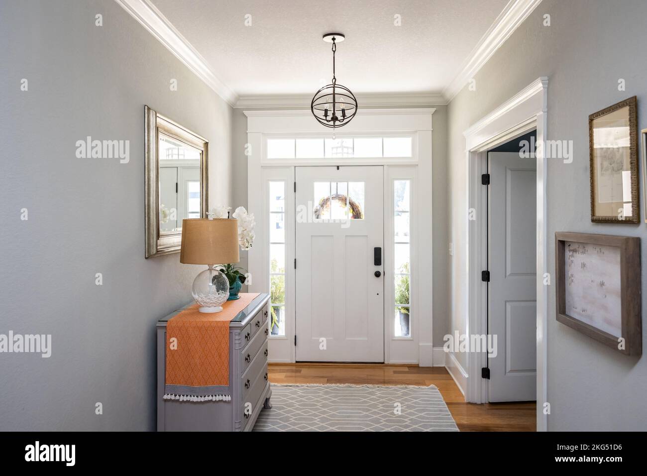 An open large and wide interior front door hallway foyer with transom