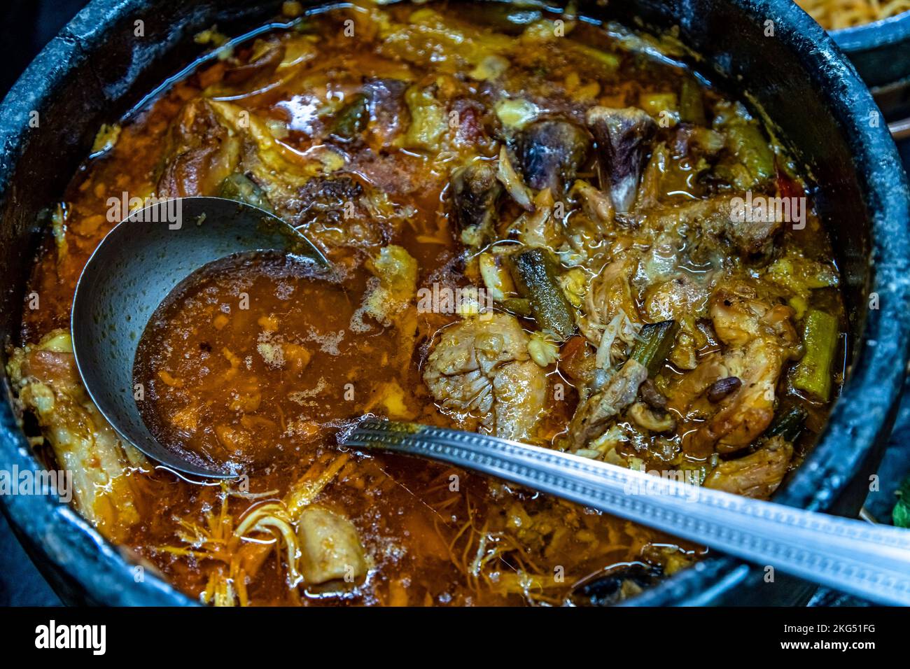 roast meat in a pot on the dinner table Stock Photo