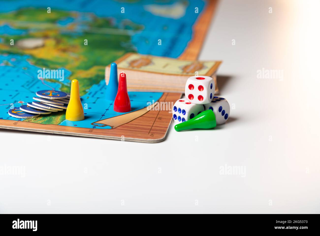 colorful game pieces with dice on board Stock Photo - Alamy