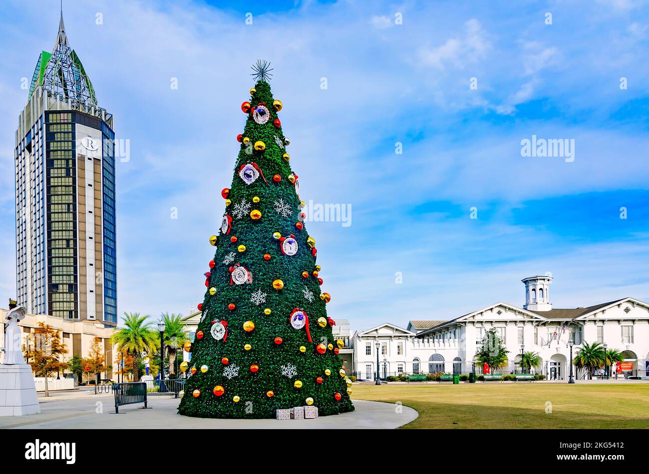 The city Christmas tree is displayed at Mardi Gras Park, Nov. 20, 2022, in Mobile, Alabama. In the background is the Renaissance Riverview Plaza. Stock Photo
