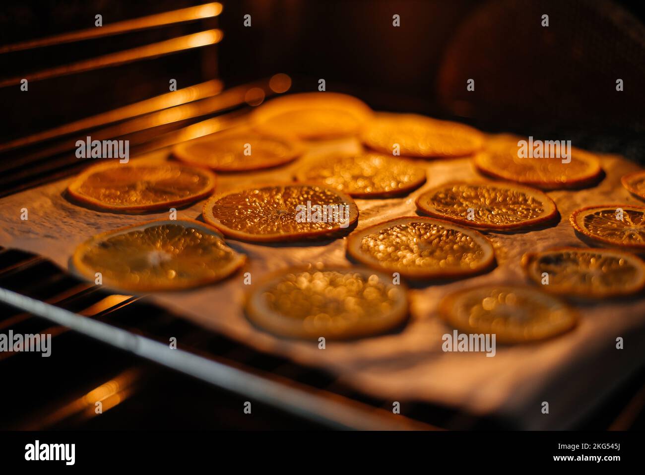 Drying orange in the oven at home for decoration. Stock Photo
