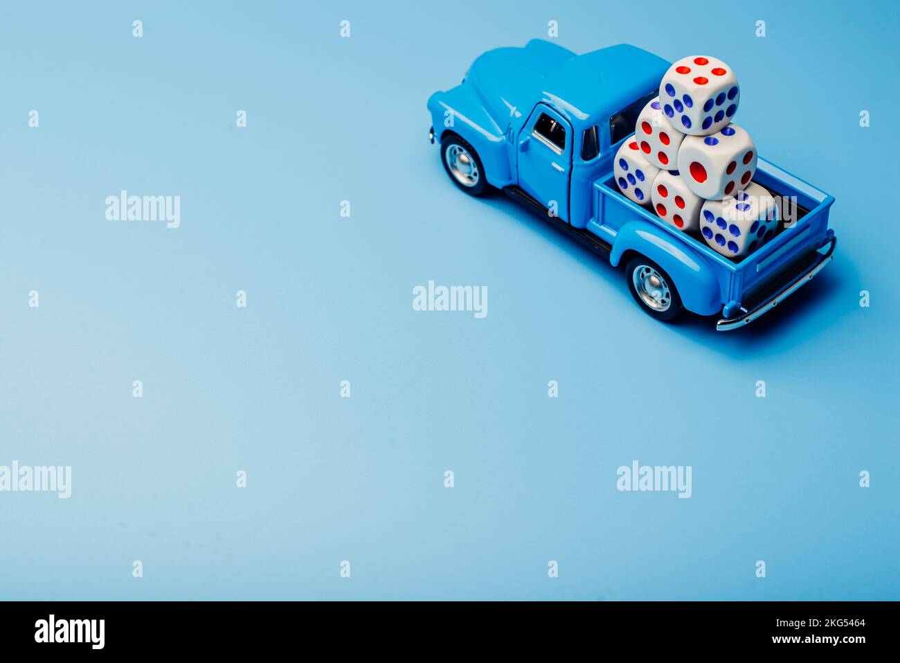 A car with cubes with numbers on a blue background. Game concept Stock ...