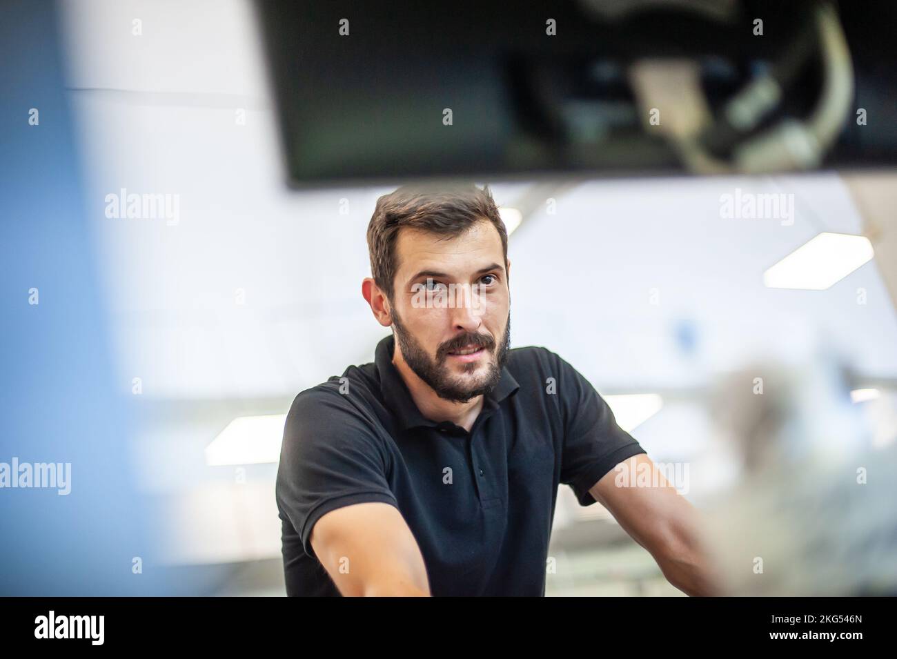 Professional worker printmaker technician operator works in printing