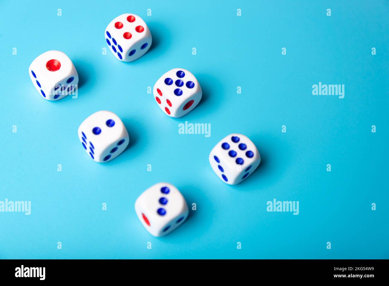 cubes with numbers on blue background. dice Stock Photo