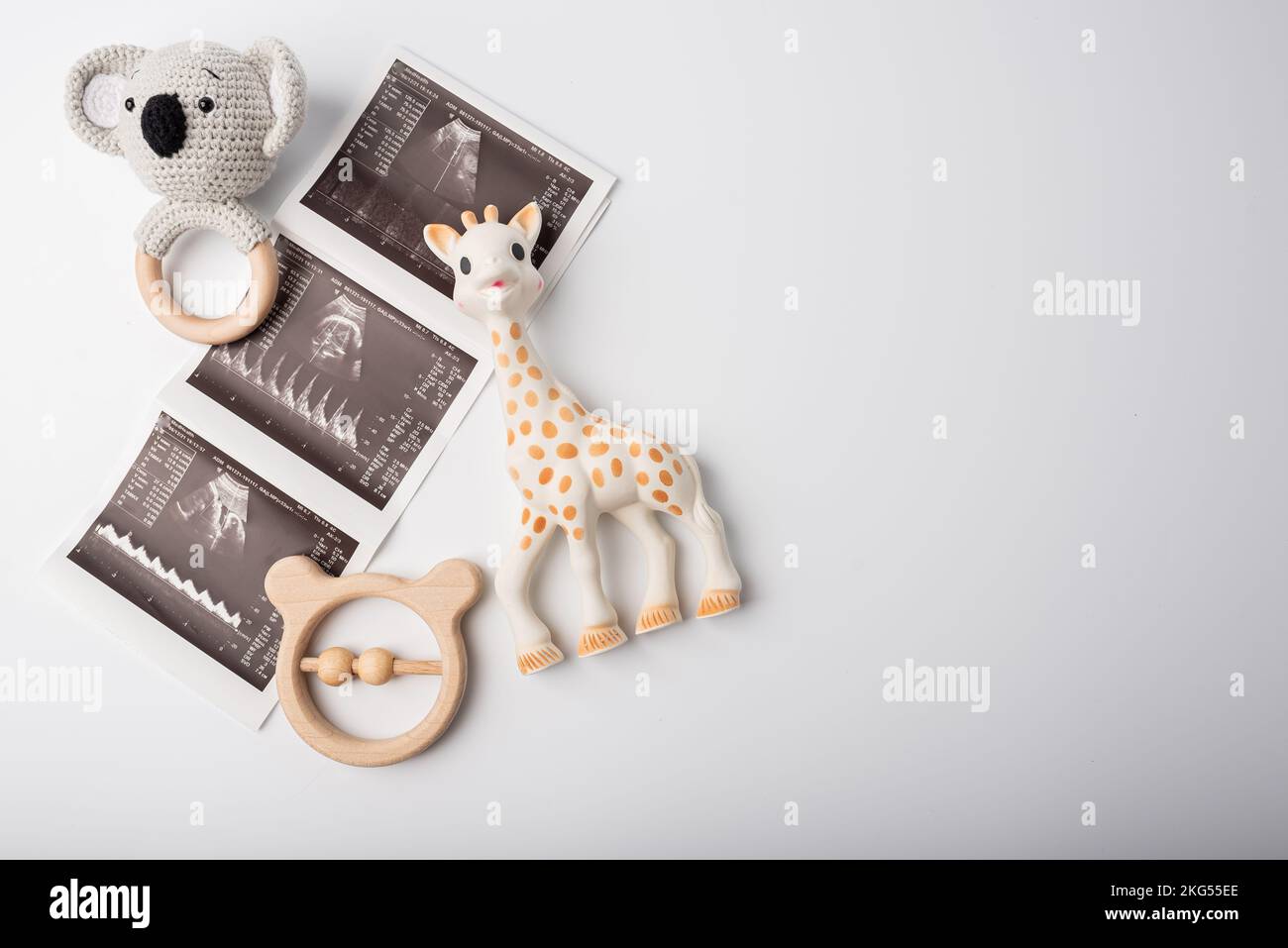 Baby toys with ultrasound picture pregnant concept on white background Stock Photo