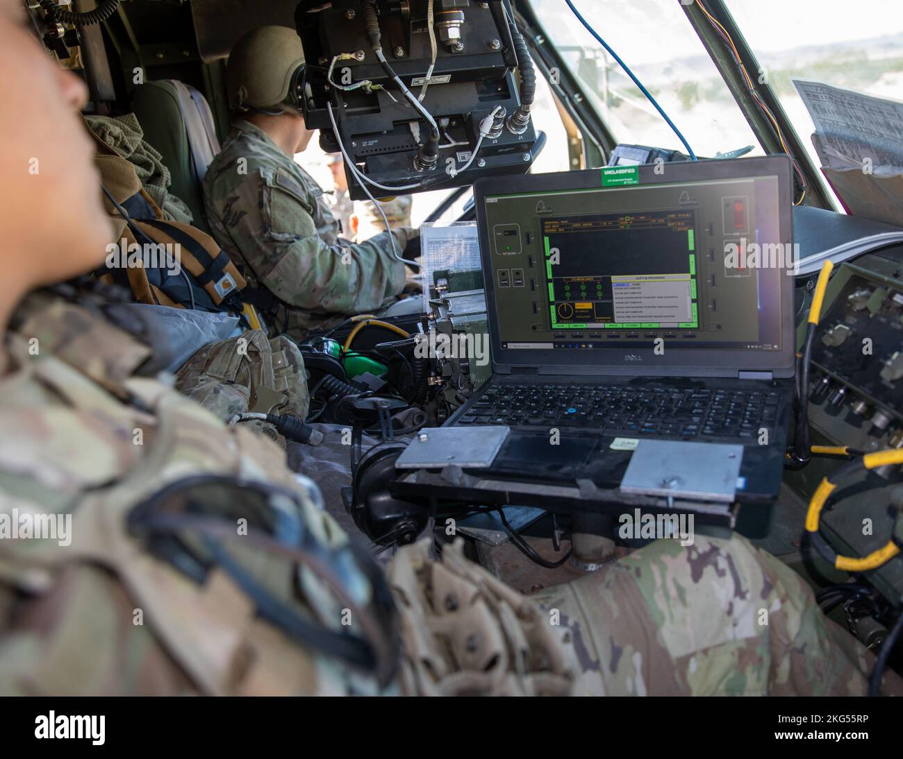 U.S. Soldiers assigned to 2nd Battalion, 20th Field Artillery Regiment, work with the Autonomous Multi-Domain Launcher (AML), on a Palletized Load System (PLS) using a Remote Interface Unit (RIU) as a part of Project Convergence 22 at Fort Irwin, California, Oct. 31, 2022. Project Convergence 22 experimentation incorporates technologies and concepts from all services and from multinational partners, including in the areas of autonomy, augmented reality, tactical communications, advanced manufacturing, unmanned aerial systems and long-range fires. Stock Photo