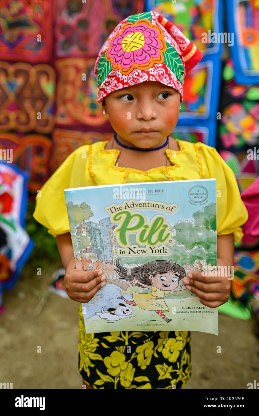 Guna Indigenous kids receiving book donations by The Adventures of Pili project Stock Photo