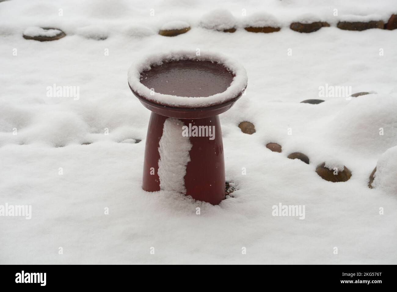A backyard bird bath after a winter snowfall in Santa Fe, New Mexico
