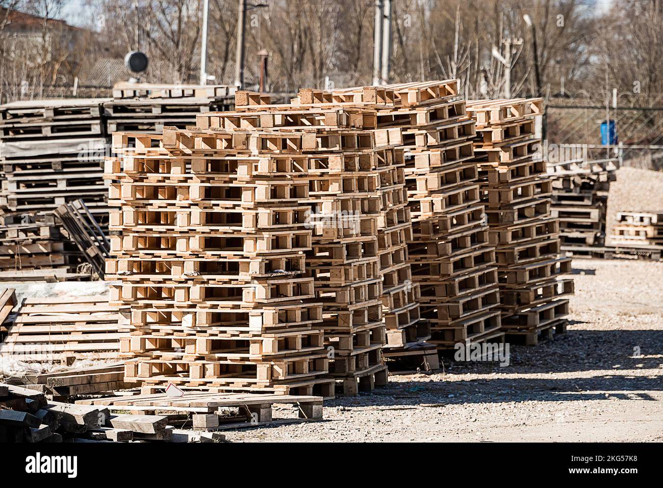 Stack of wooden pallets in warehouse. Industrial logistics and