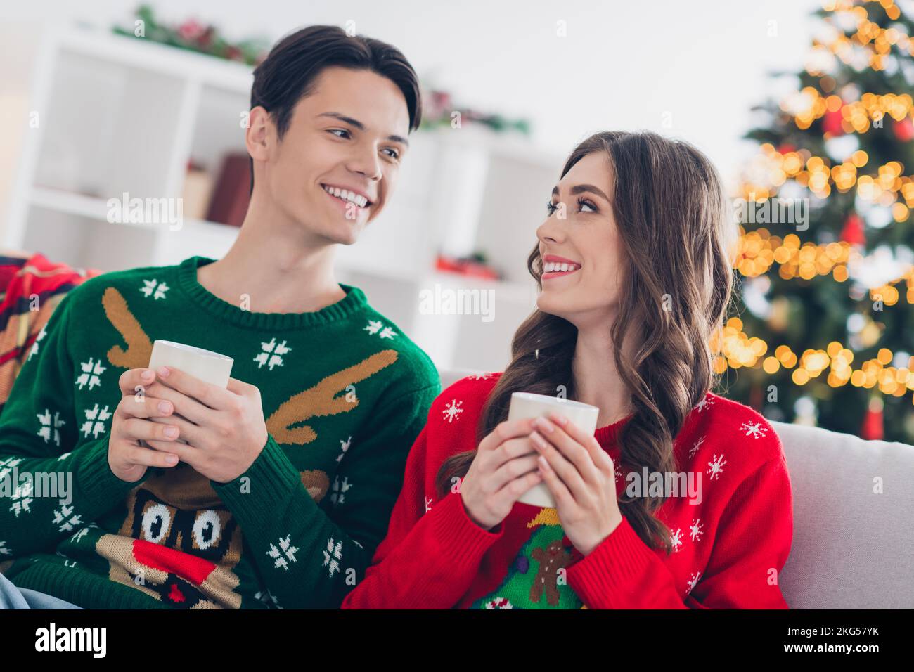 Photo of pretty funny husband wife wear print ugly sweaters enjoying