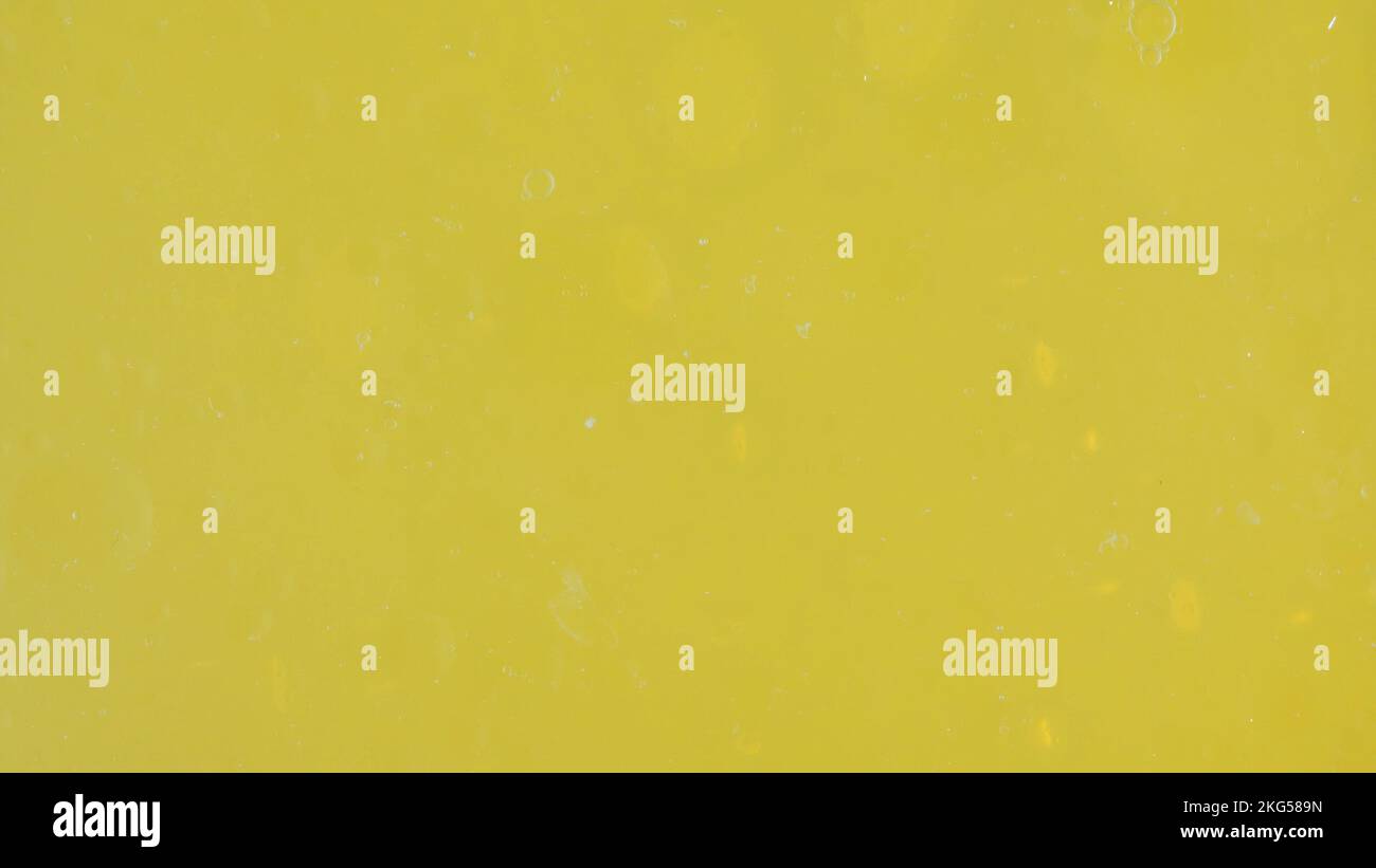 water drops on a yellow background Stock Photo - Alamy