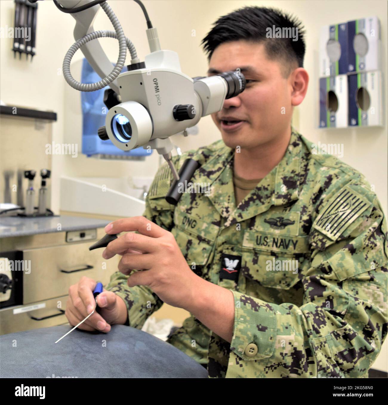 when an earful about an ear full is needed, Hospital Corpsman 3rd Class John Ong can provide any such helpful cautioning. As the lead hearing  conservation technician and general duty corpsman for Naval Hospital  Bremerton Otorhinolaryngology [better known as Ears, Nose and Throat]  department, Ong handles everything from administering hearing tests to  counseling patients on just what constitutes healthy hearing, which includes  reminding patients at times to follow the old adage of not sticking anything  in your ear smaller than your elbow, as well as adequately protect it from  damaging, ea Stock Photo