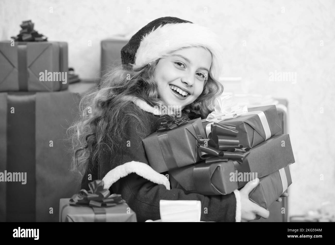 New year holiday tradition. Little santas helper concept. Kid excited about opening christmas 