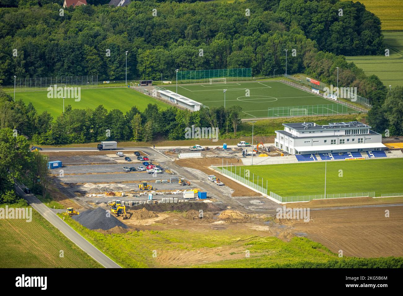 Aerial view, construction site and new construction sports field with stands and a club building with sports day care center, An der Lohschule, Rhyner Stock Photo