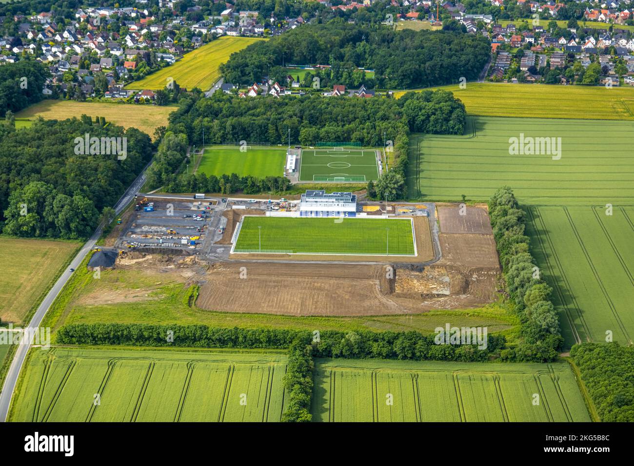 Aerial view, construction site and new construction sports field with stands and a club building with sports day care center, An der Lohschule, Rhyner Stock Photo