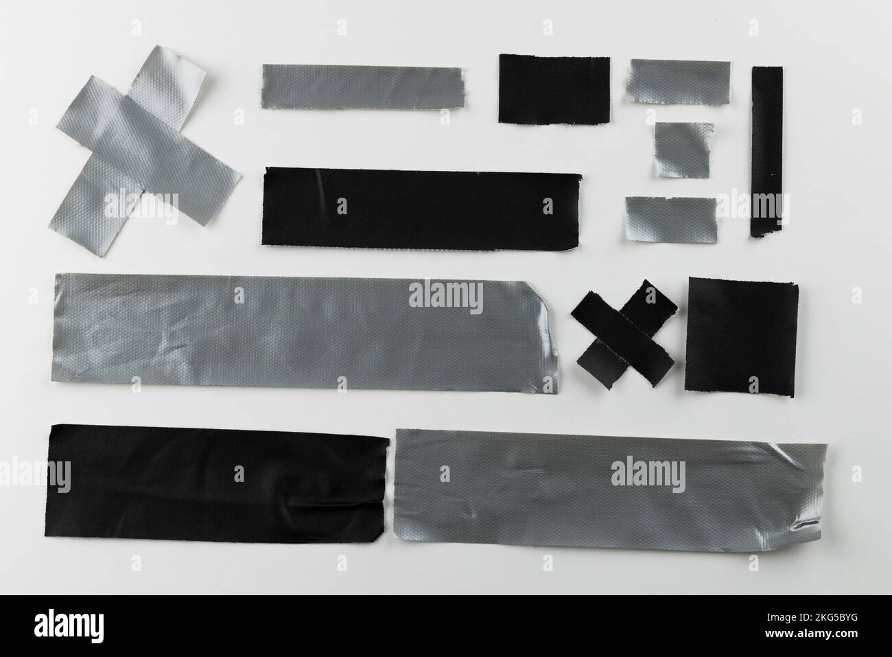 Ripped up pieces of masking tape with copy space on white background