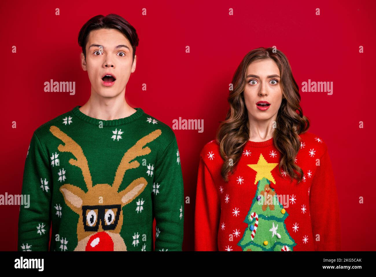 Photo of excited impressed best friends dressed xmas jumpers open