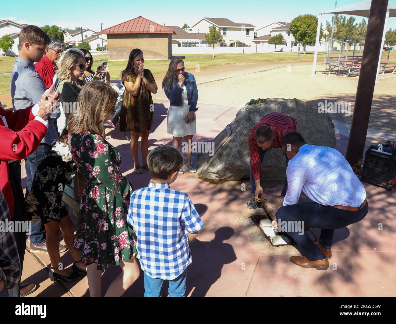 Friends and family of Thomas Meyer watch as a time capsule is opened at Thomas Meyer Memorial Field on Marine Corps Air Station Yuma, Arizona, Oct. 31, 2022. The field was dedicated to Thomas Meyer at a formal ceremony, Oct. 31, 1997, after he was struck and killed by a motor vehicle while riding a bicycle, Nov. 1, 1996. Stock Photo