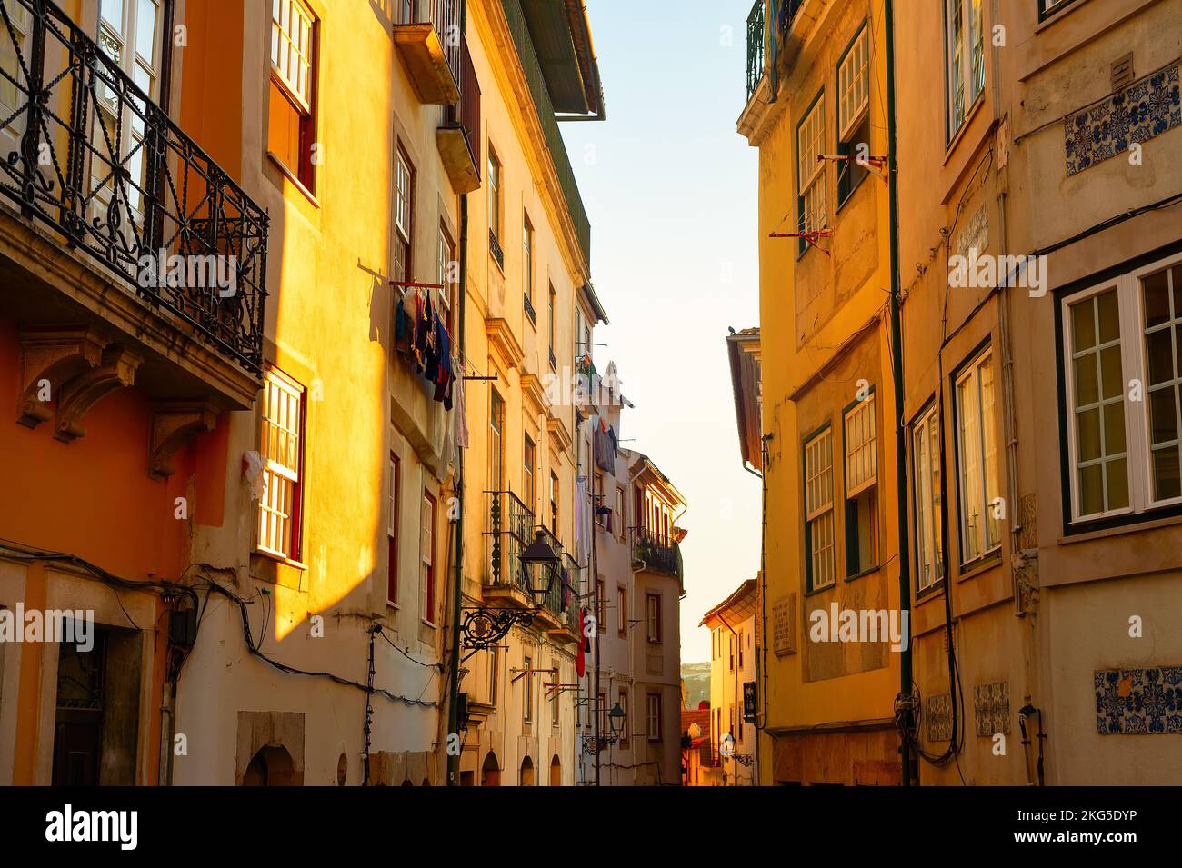 Old town narrow street in sunset light, traditional architecture facades of Porto, Portugal Stock Photo