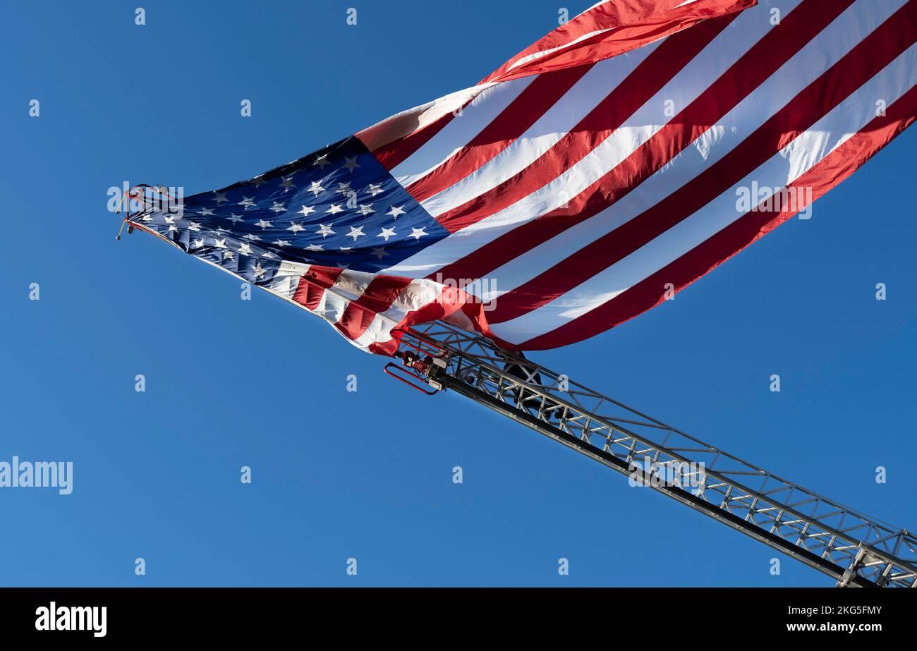 A gigantic U.S. flag billows in the wind after a Fort Jackson ...