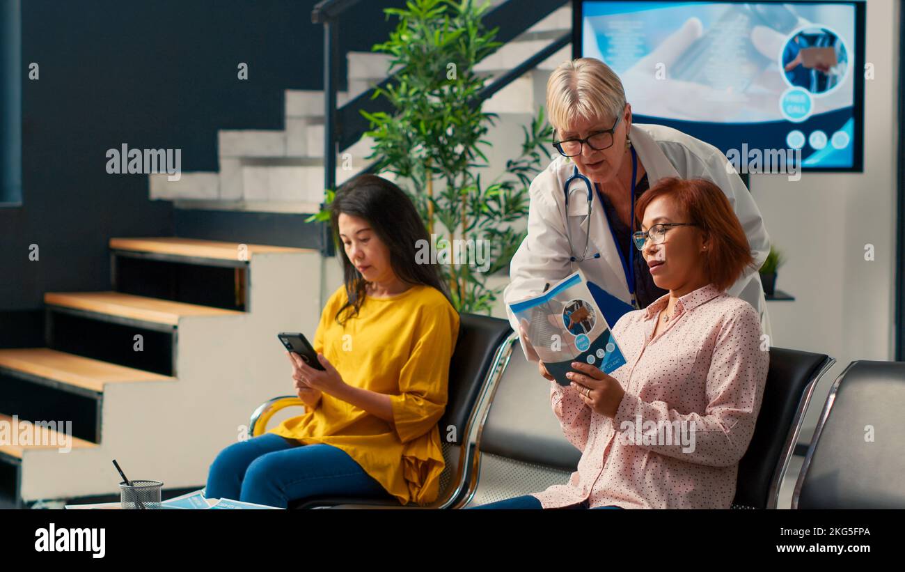Doctor giving patient documents hi-res stock photography and images - Alamy