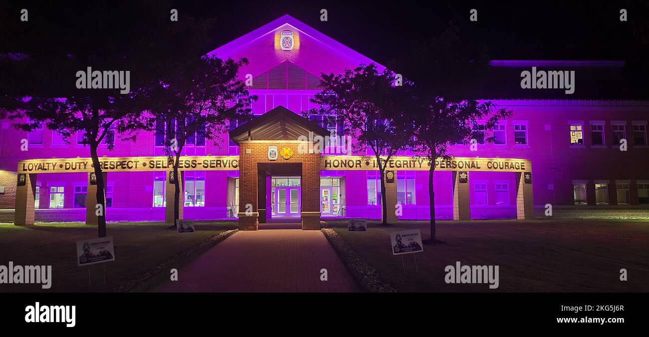 Clark Hall is awash in purple light in support of Domestic Violence Awareness Month at Fort Drum