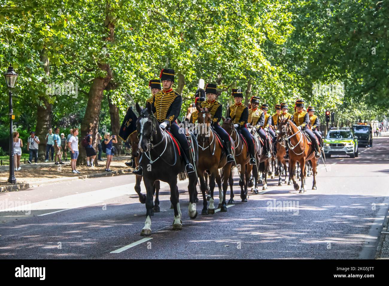 2019 07 24 London UK The Queen's Life Guard - riding horses - men of the Household Cavalry Mounted Regiment riding down road near St James Park with p Stock Photo