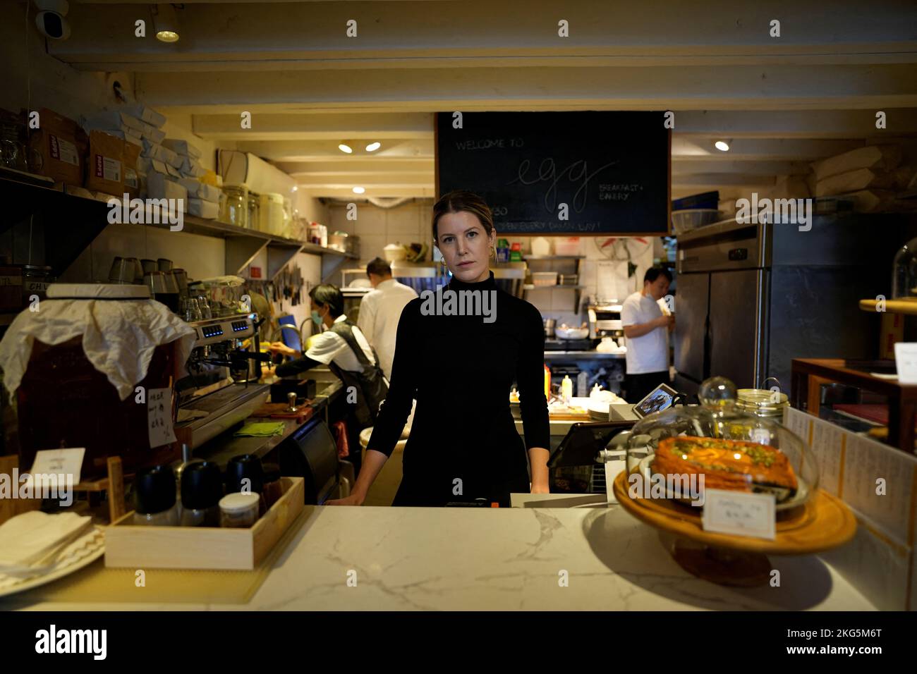 Camden Hauge, who owns the Egg cafe, poses in her cafe in central Shanghai, following the coronavirus disease (COVID-19) outbreak in Shanghai, China, November 16, 2022. REUTERS/Aly Song Stock Photo