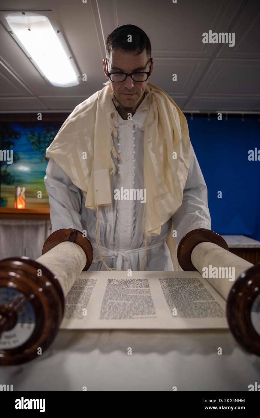 U.S. Navy Chaplain Rabbi Lt. Cmdr. Yonatan Warren, from Norfolk, Virginia, joined the crew of the first-in-class aircraft carrier USS Gerald R. Ford (CVN 78) to celebrate the Jewish High Holy days and conduct Yom Kippur services in the ship’s chapel, Oct. 5, 2022. The Gerald R. Ford Carrier Strike Group (GRFCSG) is deployed in the Atlantic Ocean, conducting training and operations alongside NATO Allies and partners to enhance integration for future operations and demonstrate the U.S. Navy’s commitment to a peaceful, stable and conflict-free Atlantic region. Stock Photo