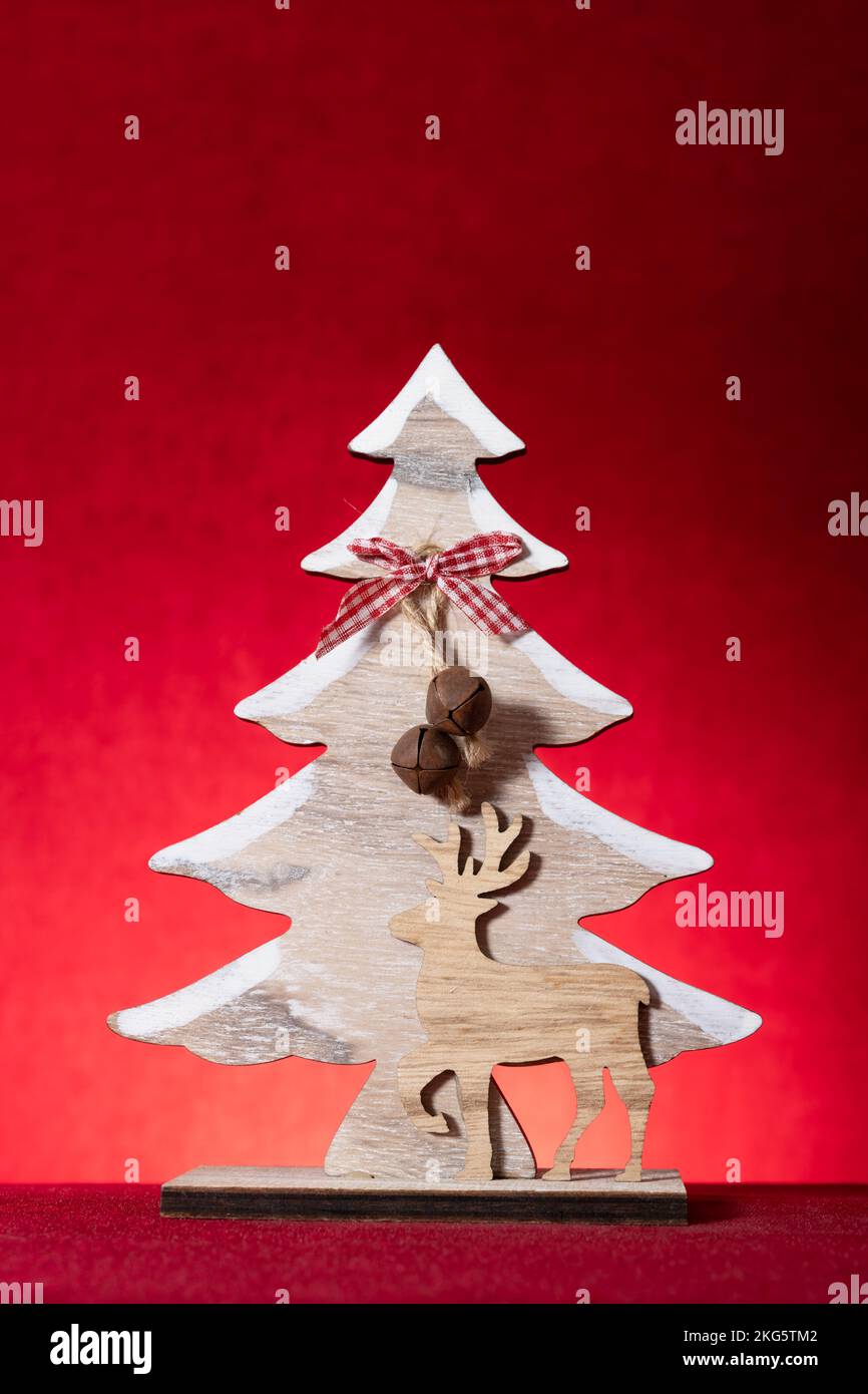 Christmas tree on a red background vertical composition Stock Photo - Alamy