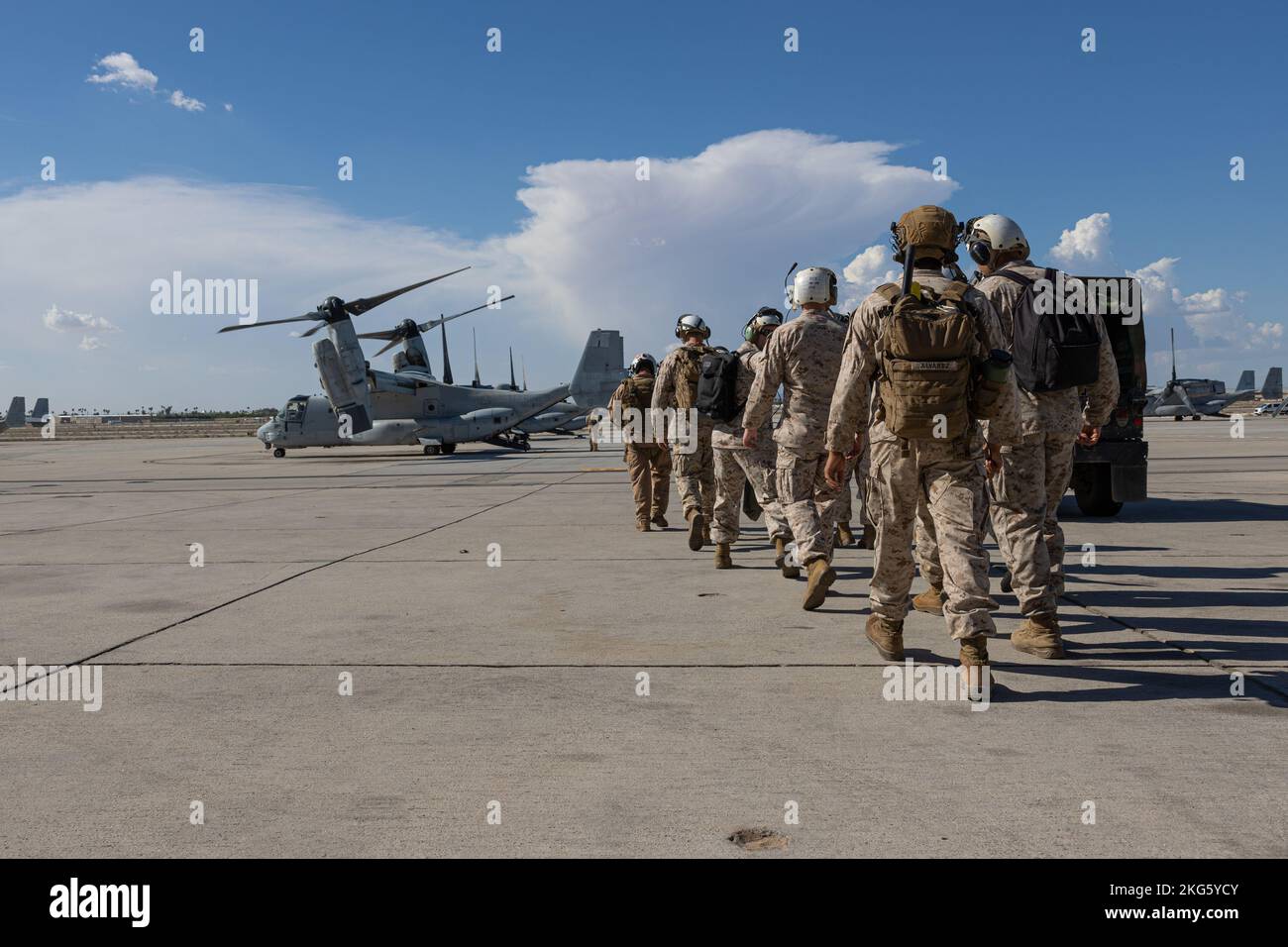 U.S. Marines assigned to Marine Aviation Weapons and Tactics Squadron One (MAWTS-1) prepare to embark an MV-22B Osprey during Weapons and Tactics Instructors (WTI) course 1-23 at Marine Corps Air Station Yuma, Arizona, Oct. 5, 2022. WTI is a seven-week training event hosted by MAWTS-1, providing standardized advanced tactical training and certification of unit instructor qualifications to support Marine aviation training and readiness, and assists in developing and employing aviation weapons and tactics. Stock Photo
