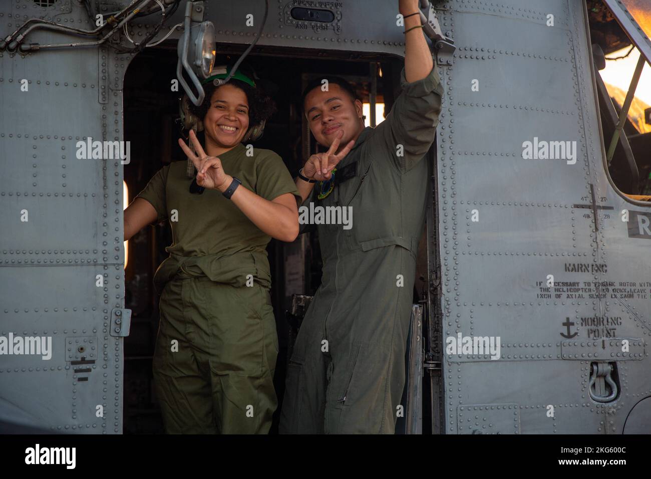 U.S. Marine Corps Cpl. Kiara Mazara (left) and Cpl. Milton Rodriguez-Chaves, avionics technicians with Marine Heavy Helicopter Squadron (HMH) 464, pose for a photo at an undisclosed location, Oct. 6, 2022. HMH-464 provided assault support for Marine Forces Special Operations Command during Exercise Raven 23-1 to enhance combat readiness in an unfamiliar expeditionary environment. HMH-464 is a subordinate unit of 2nd Marine Aircraft Wing, the aviation combat element of II Marine Expeditionary Force. Stock Photo