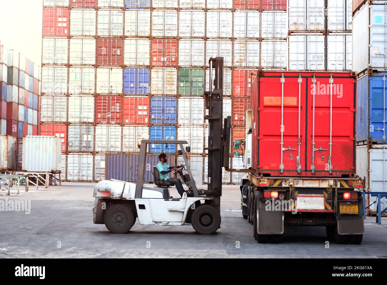 Forklift driver in industrial container warehouse Stock Photo Alamy