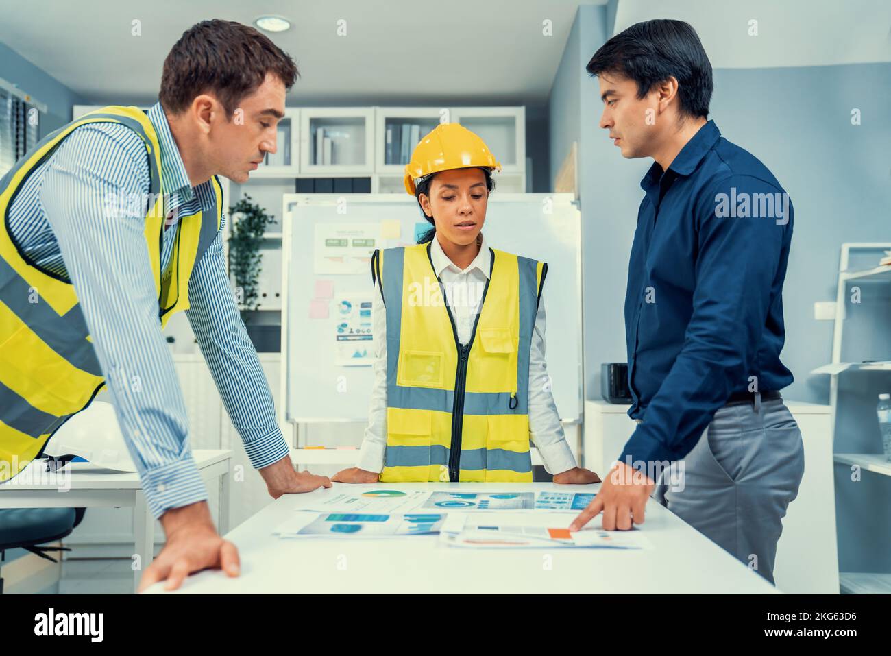 Employer Engineer A group of competent engineers and employer discuss plans in the office ...