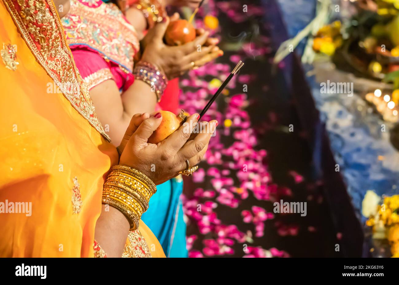 devotee praying for sun god during Chhath festival from flat angle Stock Photo