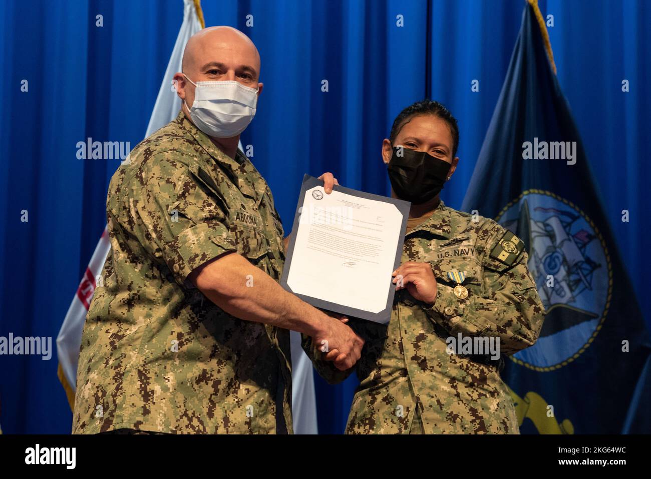 Hospital Corpsman 1st Class Corrine Ramos receives her Military