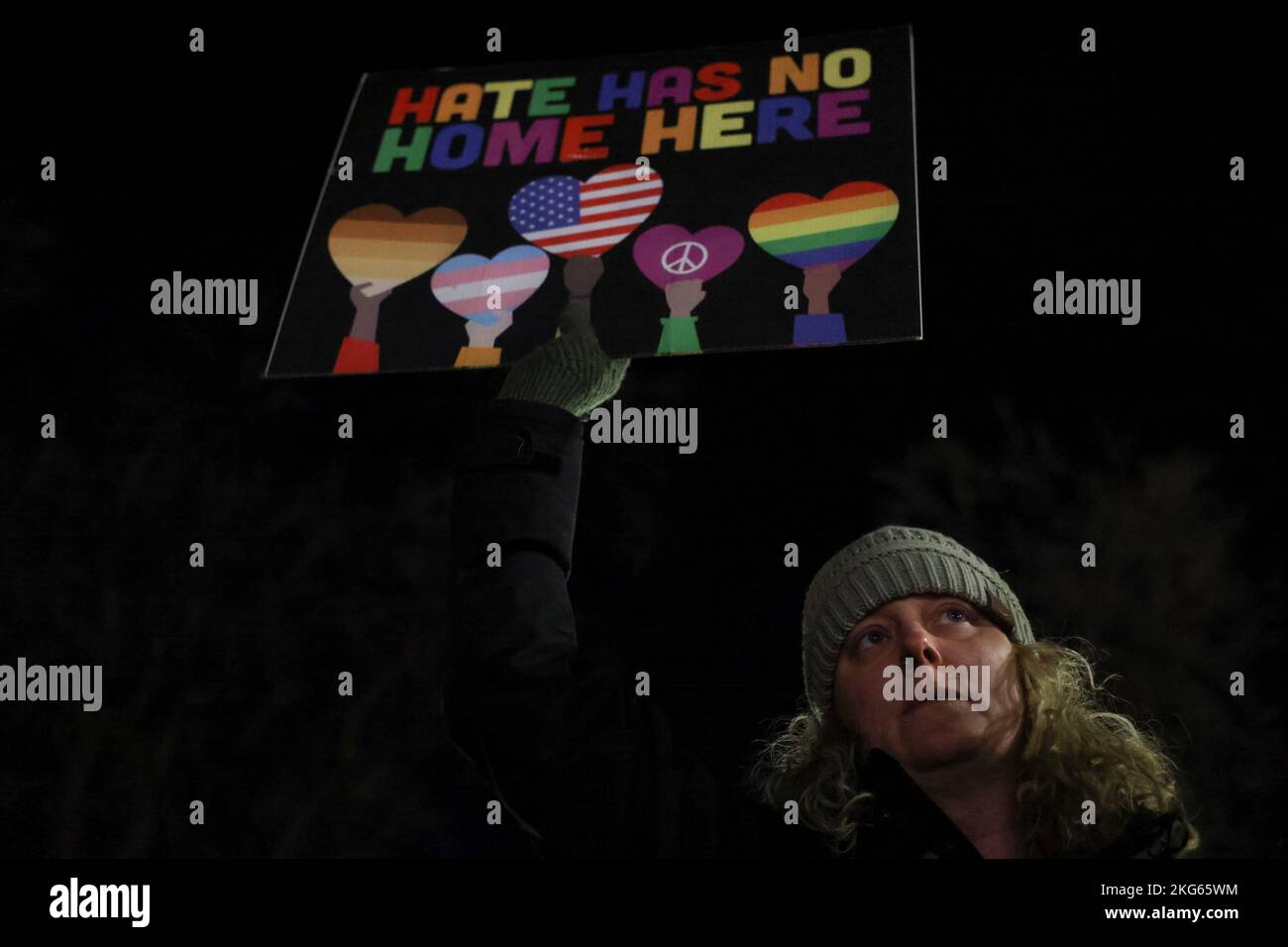 Kendall Allen holds a sign as she attends a vigil after a mass shooting