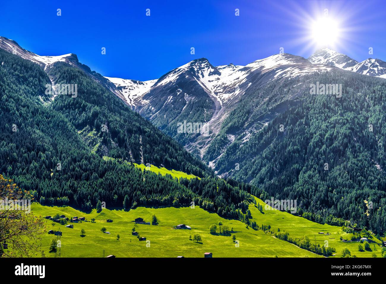 Fields with houses in Swiss Alps mountains, Moerel, Filet, Oestlich