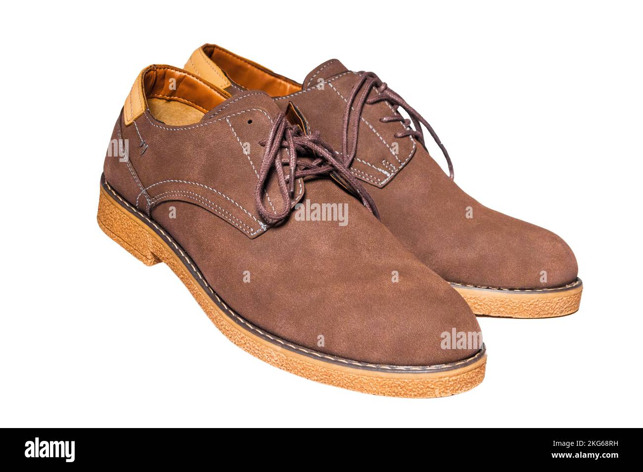 Pair of men's brown suede laceup shoes isolated on white background