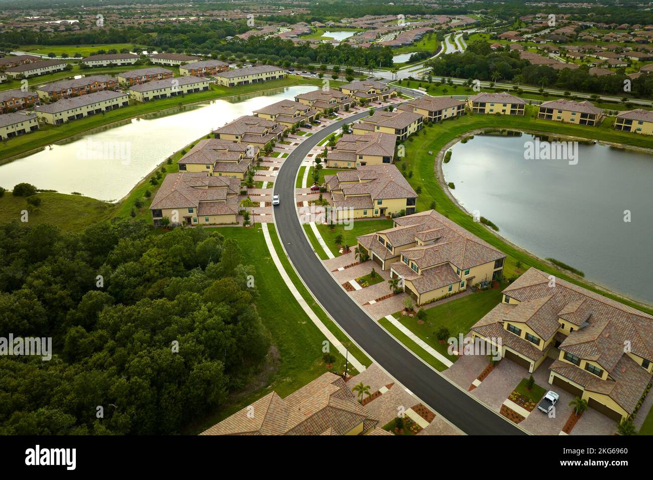 Aerial view of tightly located family houses in Florida closed suburban