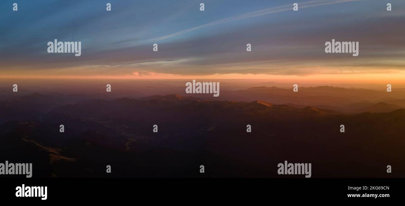 Beautiful mountain panoramic landscape with hazy peaks and foggy valley ...