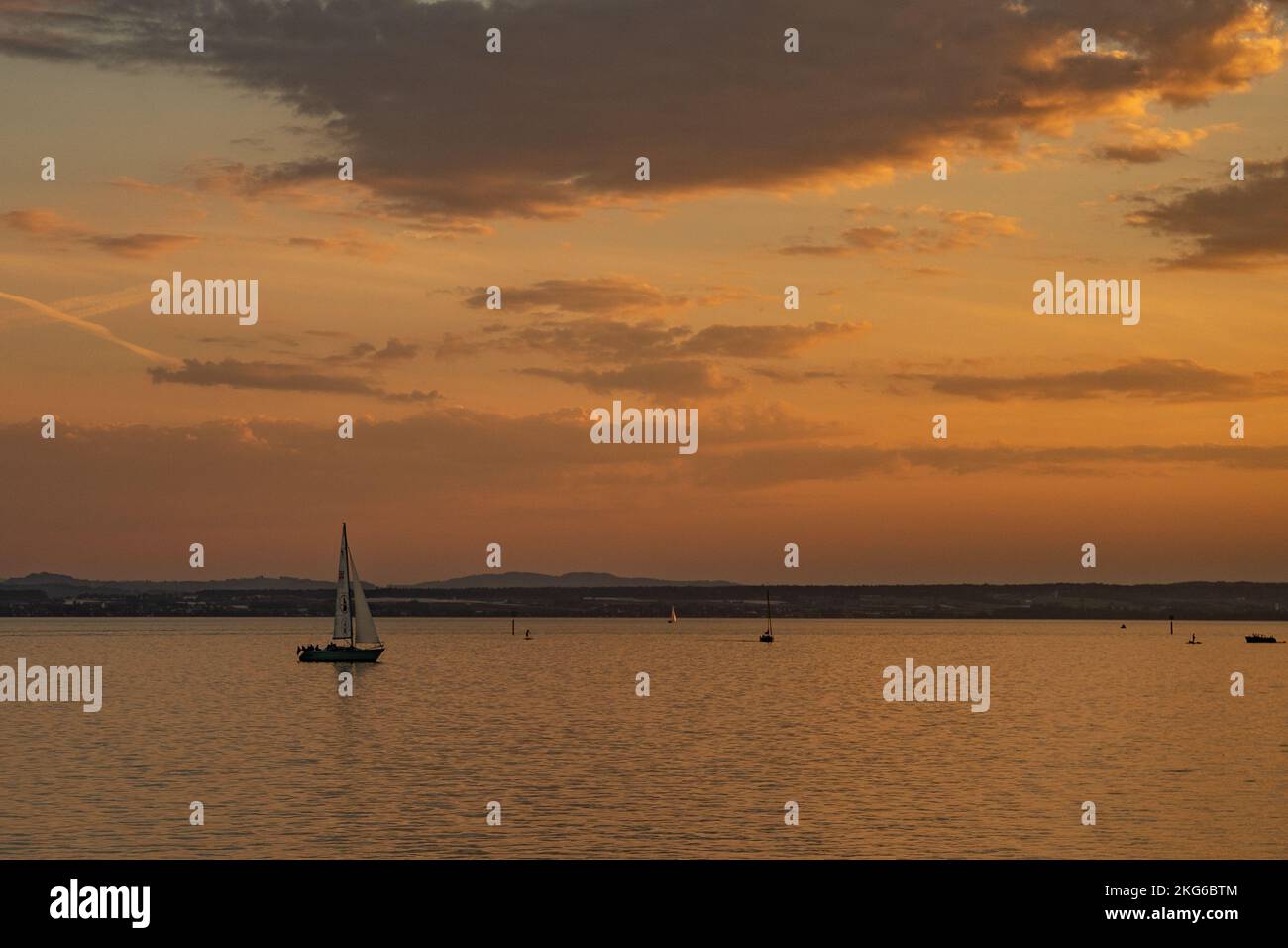 An aerial view of boat floating in sea during sunset Stock Photo - Alamy
