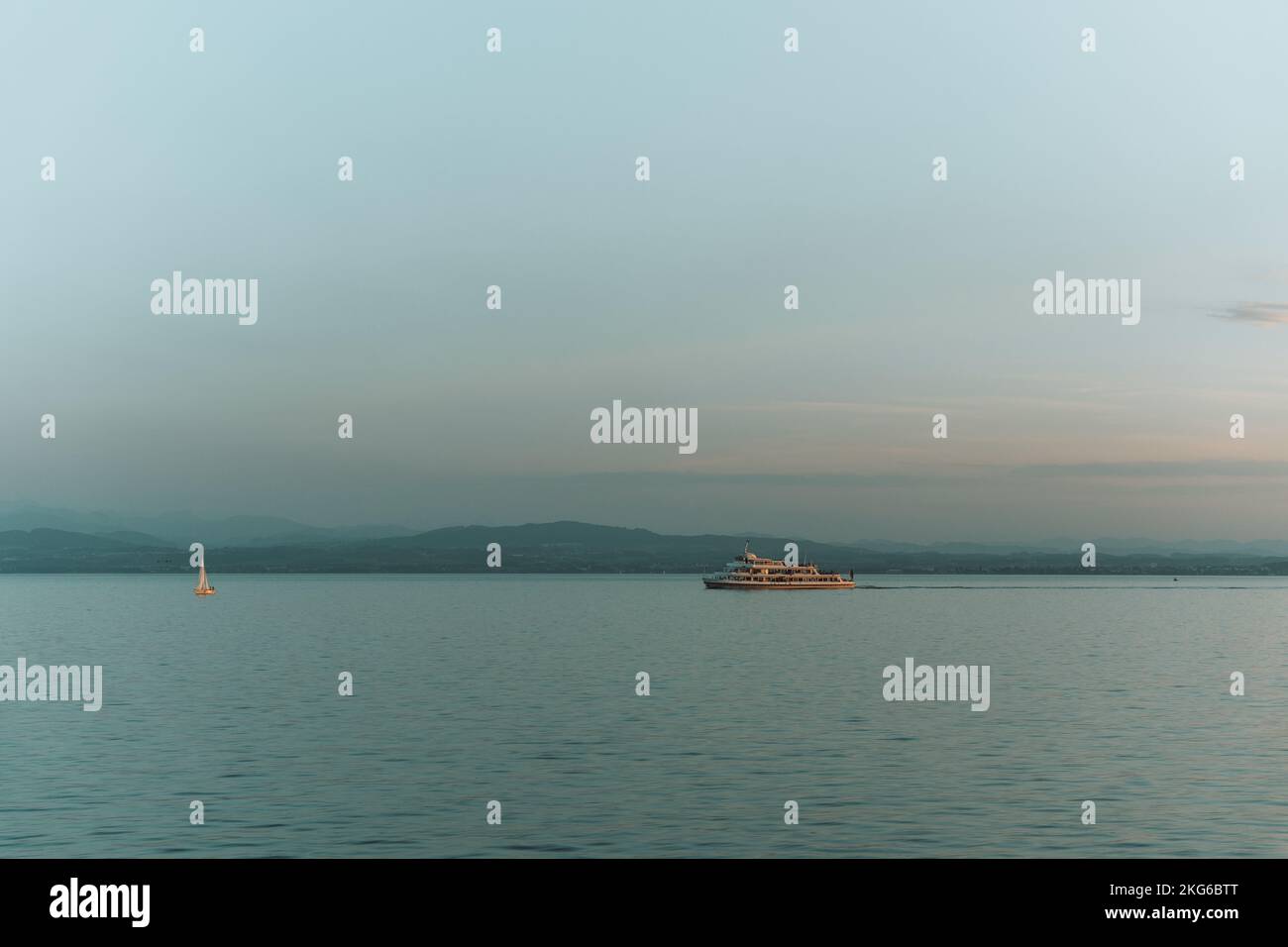 An aerial view of boat floating in sea during sunset Stock Photo - Alamy