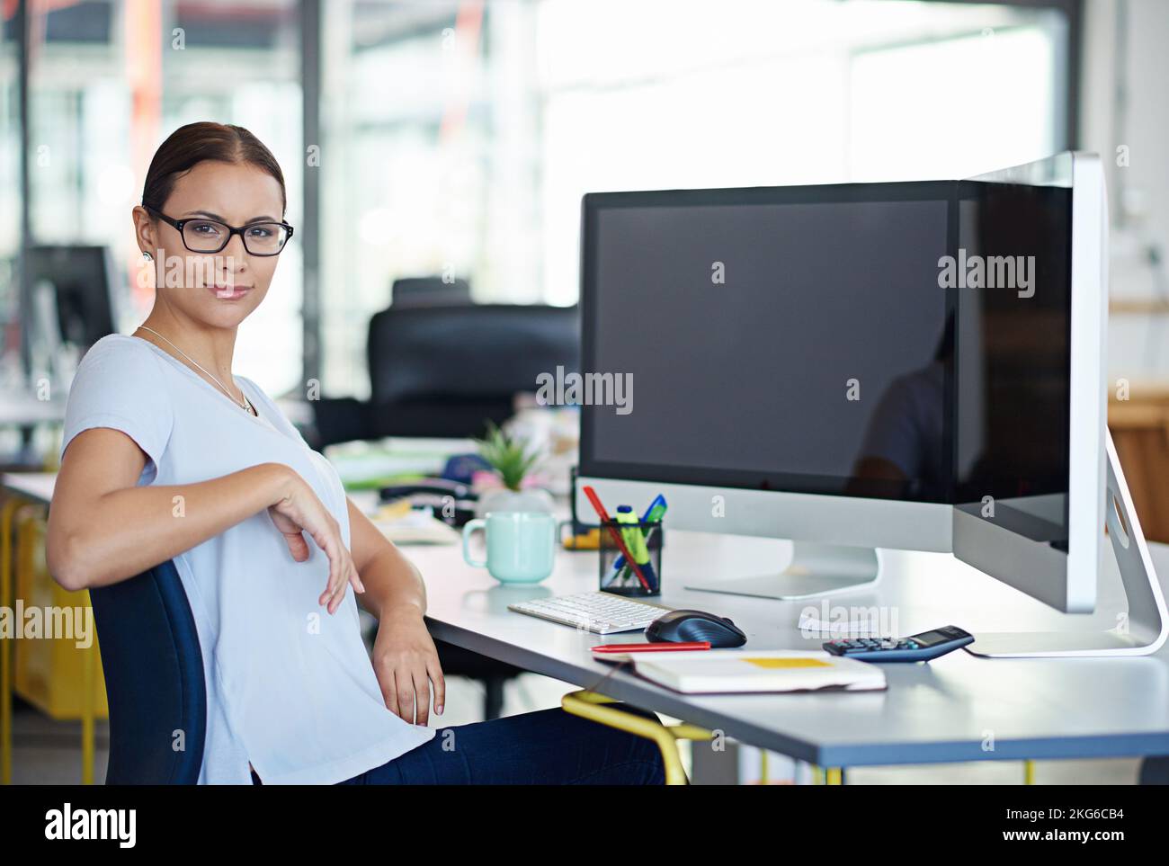 Developing tomorrows tech today. a designer at their workstation in an office. Stock Photo
