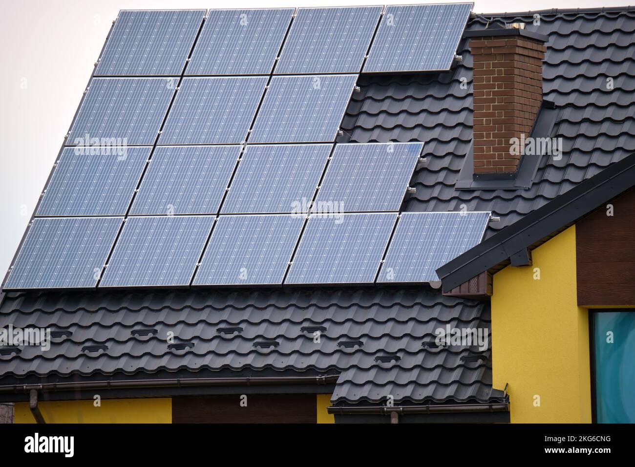Residential house with rooftop covered with solar photovoltaic panels