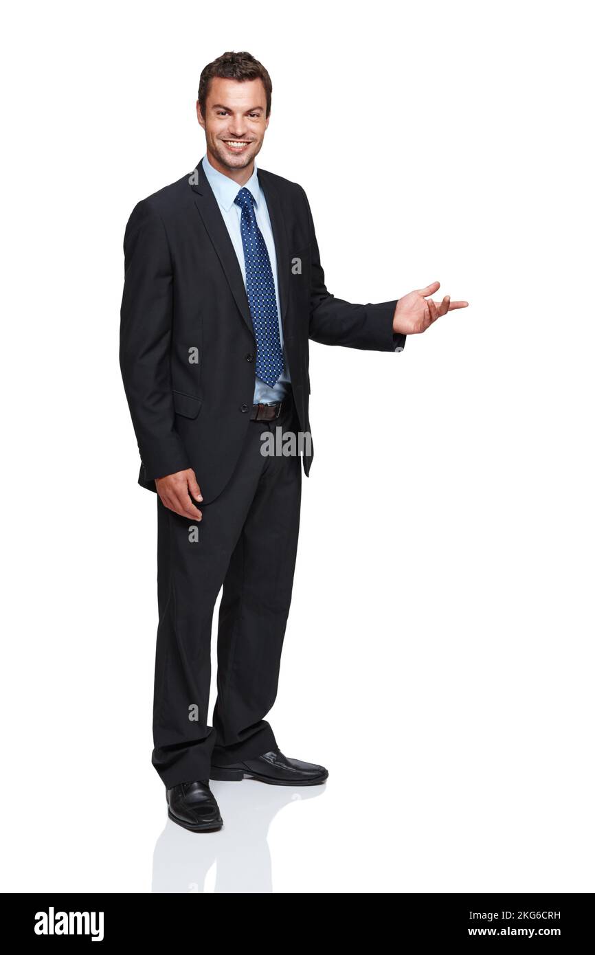 This is a great deal - Car Salesman. Full length of a young businessman gesturing towards something while isolated on white. Stock Photo