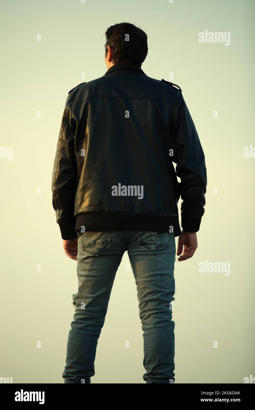Man in leather jacket standing hi-res stock photography and images - Alamy