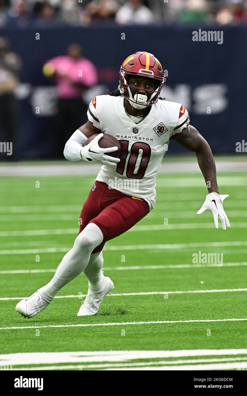 Washington Commanders wide receiver Curtis Samuel (10) runs around the end during the NFL Football Game between the Washington Commanders and the Hous Stock Photo
