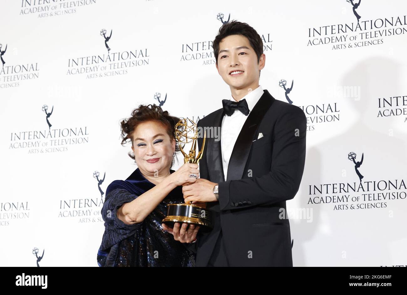 New York, United States. 21st Nov, 2022. Film producer Miky Lee (L) holds her 2022 International Emmy Directorate Award while standing with South Korean actor Song Joong-ki at the 50th International Emmy Awards in New York City on Monday, November 21, 2022. Photo by John Angelillo/UPI Credit: UPI/Alamy Live News Stock Photo